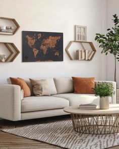 a living room with a couch, coffee table and shelves on the wall above it