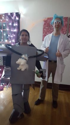 two people dressed up as characters holding stuffed animals