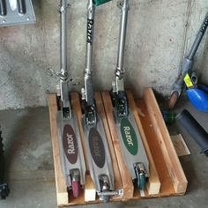 four different types of skis are lined up in a row on the floor next to each other