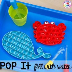 a blue tray with some plastic items on it and the words pop't fill with water