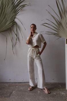 Upgrade your summer wardrobe with our organic cotton two-piece set. Made with sustainability in mind, this set offers both comfort and style. Pair it with our linen short sleeve shirt for a breezy and effortless look. Explore our collection of linen women's sets, perfect for embracing the boho style. Whether you're going on a summer holiday or simply enjoying the warm weather, our linen clothing line has you covered. Stay chic and comfortable with our summer holiday clothes designed for women wh Beige Cotton Summer Sets, Beige Summer Cotton Sets, Summer Linen Loungewear Set, Casual Linen Summer Set, Casual Linen Sets For Summer, Beige Cotton Sets For The Beach, Beige Cotton Beach Set, Cotton Bottoms Matching Set For Summer, Summer Cotton Bottoms Matching Set