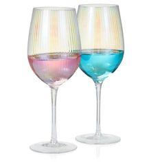 two wine glasses with different colored liquids in them