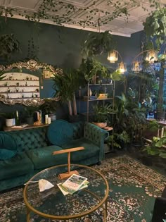 a living room filled with green furniture and lots of plants