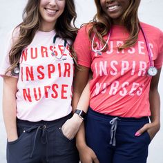 two young women standing next to each other wearing nurse t - shirts and scrubs