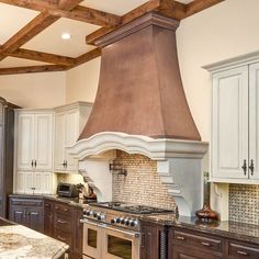 a kitchen with an oven, stove and counter tops in it's center island