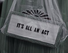 a plastic bag that says it's all an act