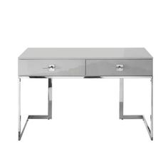 a white desk with two drawers and chrome legs on the bottom, against a white background