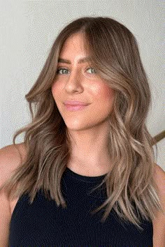 This trendy bronde hairstyle seamlessly combines natural brown and blonde shades, creating a sun-kissed look that exudes an effortless chic vibe. The soft waves and face-framing layers add volume and movement, enhancing the overall dimension of the hair. Ideal for brunettes seeking to brighten their locks, this versatile - Click to see more of Enchanting Bronde Hues: 27 Stunning Hair Transformations for Brunettes and follow us for more hairstyle ideas. // Photo Credit: Instagram @pelobylago Soft Brown Balayage Hair, Light Brunette All Over Color, All Over Color Light Brown, Blonde To Brunette Hair Transformation, Light Brown Hair Styles Medium, Brown Hair Subtle Dimension, Brightened Brown Hair, Soft Highlights Brown Hair, Brown But Blonde Hair