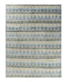 an area rug with blue and beige designs