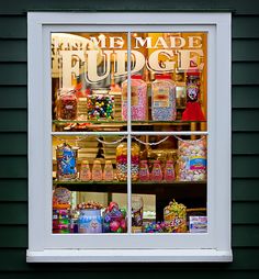 a store front window filled with lots of candy