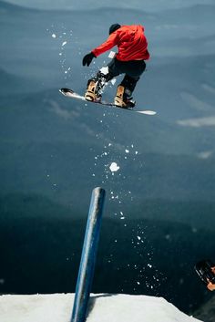 a snowboarder in the air doing a trick