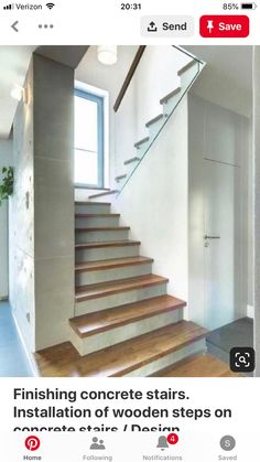 the stairs are made of wood and have glass railings