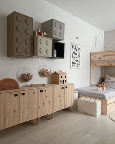 a bedroom with a bed, dressers and other items in the room that are made out of wood