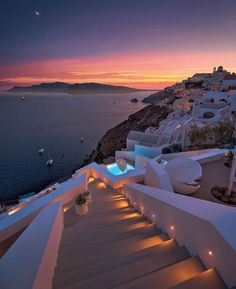 stairs leading up to the ocean at night