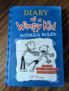 a book with the title diary of a wimpy kid