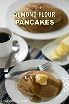 pancakes with butter and syrup on them sitting on a plate next to a cup of coffee