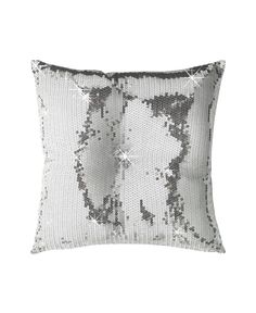 a white and silver pillow with sequins on the front, sitting against a white background