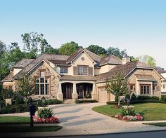 a large house with lots of windows and landscaping