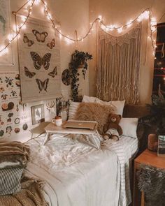 an instagram photo of a bedroom with lights strung above the bed and stuffed animals on the wall