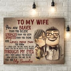 a couple kissing in front of a brick wall with the words to my wife