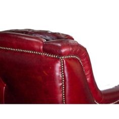 a red leather chair with studded trimmings