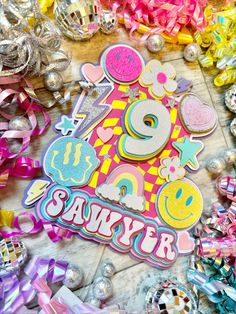 an image of a happy 90th birthday card surrounded by ribbons and decorations on the floor