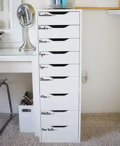 the drawers are labeled with different types of hairbrushes and other things on them