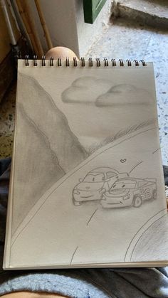 a drawing of two cars driving down a road