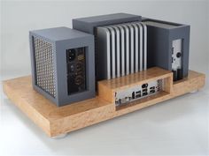 two computer towers sitting on top of a wooden shelf