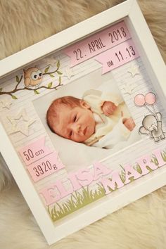 a baby's birth photo frame is shown in pink and white with an owl