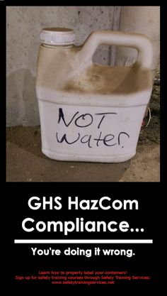 a white jug with graffiti on it sitting in front of a wall that says ghs hazcom complaints you're doing it wrong