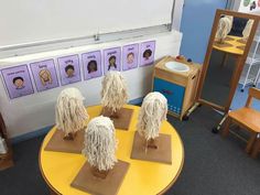 some sheep are on display in a classroom