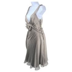 During his first year as French Christian Dior creative director in Paris for haute couture and ready-to-wear in 1997, John Galliano designed for his Spring/Summer 1998 button-enhanced collection this ballerina-like bias-cut silvery semi-transparent ribbed silk georgette layered plunging V-neck sleeveless evening gown, which was purchased at the flagship Christian Dior Boutique in Paris by the sole owner who never wore it. As an underlay, the otherwise see-through gown has a slip dress of grey b Ultra Feminine Style, Dior Boutique, 90s Y2k Fashion, Sassy Dress, Bias Cut Dress, Ballerina Dress, Aesthetic Grunge Outfit, Haute Couture Dresses, Dior Haute Couture