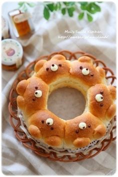 a cake with teddy bears on it sitting on top of a table next to other items