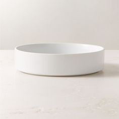 a white bowl sitting on top of a table