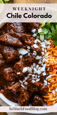 a white bowl filled with rice and meat next to cilantro, red peppers and green onions