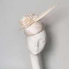 A hand blocked ivory satin silk pillbox fascinator. Beautiful silk flowers,  shaped feather and  veiling. 14 cms diameter fine for Royal Ascot Royal Enclosure. Secured by hat elastic which is easily hidden. This fascinator can be made in  any silk colour contact me with any questions.  Modifications can also be made e.g. different feathers. This item is made to order please allow 1-2 weeks processing. Elegant Cream Fascinator For Vintage Events, Adjustable Feathered Mini Hats For Weddings, Elegant Cream Costume Hats For Vintage Events, Feathered Wedding Fascinator For Royal Ascot, Feathered Fascinator For Wedding At Royal Ascot, Feather Fascinator For Wedding And Royal Ascot, Elegant Feathered Fascinator For Vintage Events, Elegant Feather Fascinator For Vintage Events, Vintage Cream Fascinator For Wedding