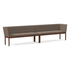 an image of a couch that is in the shape of a long sofa with wooden legs