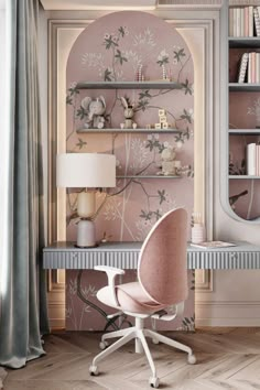 a pink chair sitting in front of a desk with bookshelves and shelves on it