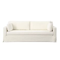 a white couch with two pillows on it