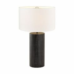 a black table lamp with a white shade on the top and an off - white light at the bottom