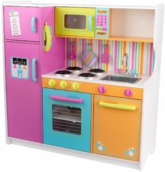 a toy kitchen with pink, yellow and blue appliances