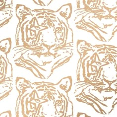 an image of tiger heads drawn in gold on white paper