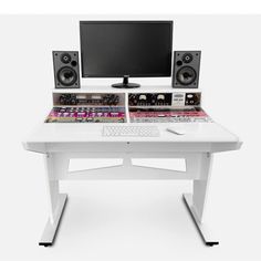 a computer desk with speakers and a monitor on it's side, sitting in front of a white background