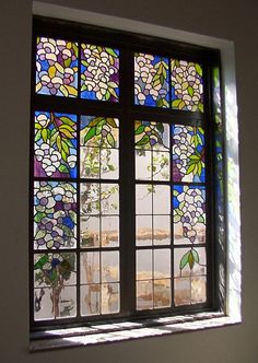 a stained glass window with flowers on it