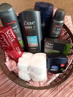 a basket filled with men's grooming products on top of a tablecloth