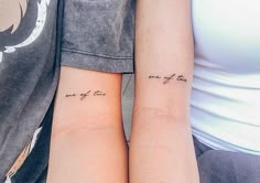 two people with matching tattoos on their arms