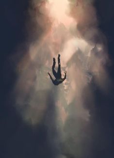 a person floating in the air with their hands up above them and clouds behind them