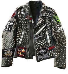 ➤ Steampunk Gothic leather jacket crafted from premium cowhide for durability and style. ➤ Adorned with heavy metal spikes and studs, adding an edgy, rebellious touch. ➤ Features iconic Rancid and Motley Crue patches for a bold gang street style. ➤ Ideal for bikers, gangsters, and streetwear enthusiasts looking to make a statement. ➤ Available in all colors to suit your personal preference. ➤ Customize the jacket with your choice of patches, or additional details. ➤ Personalize it further to cre Punk Style Fitted Leather Jacket With Spikes, Punk Outerwear With Spikes For Streetwear, Fitted Punk Leather Jacket With Spikes, Leather Jacket Spikes, Crust Punk Leather Jacket, Punk Jacket, Punk Culture, Metal Spikes, Gothic Punk