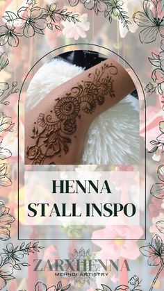 henna tattoo on the back of a woman's arm with flowers around it